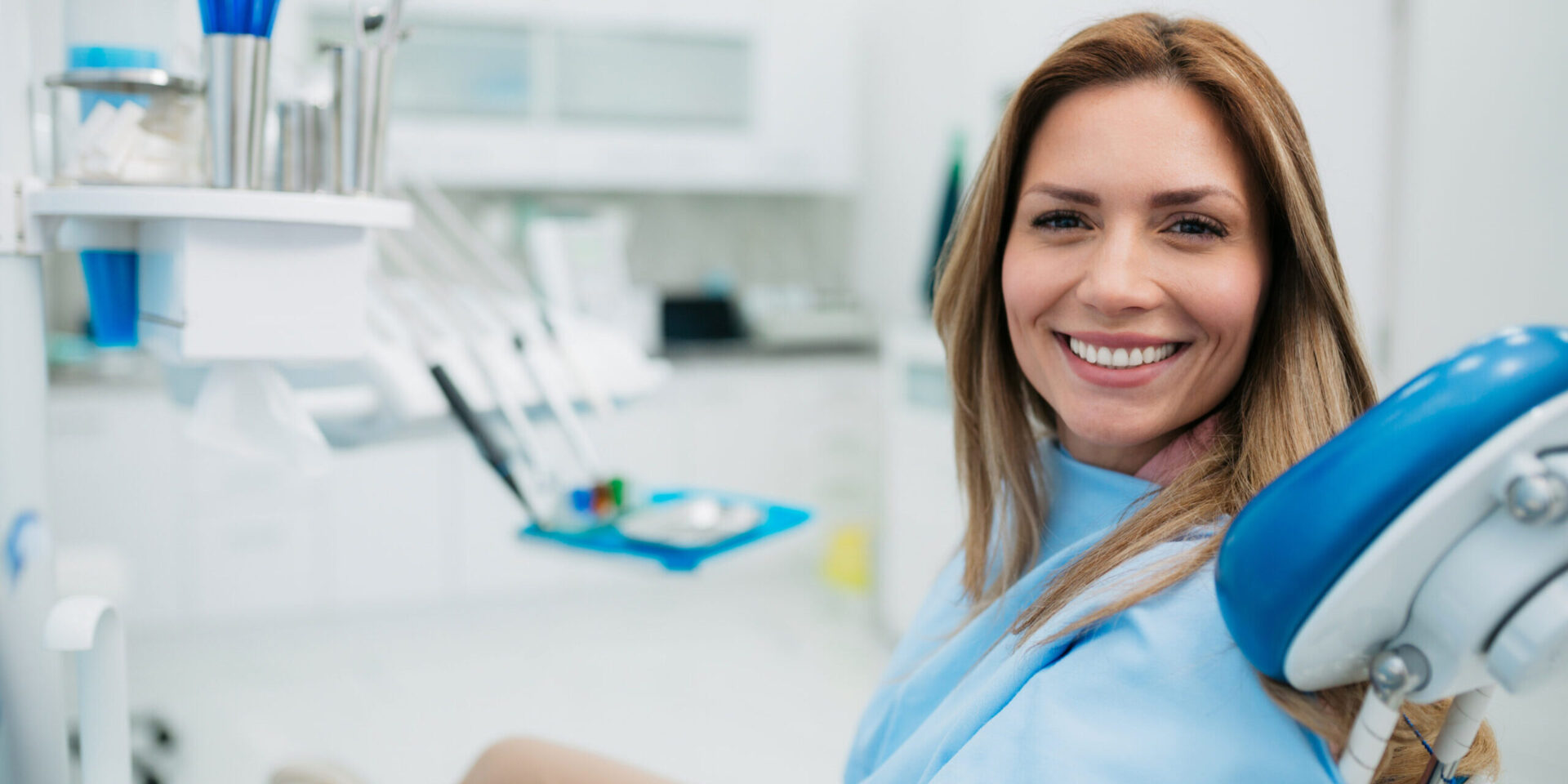 Happy Woman Visiting A Dentist Office