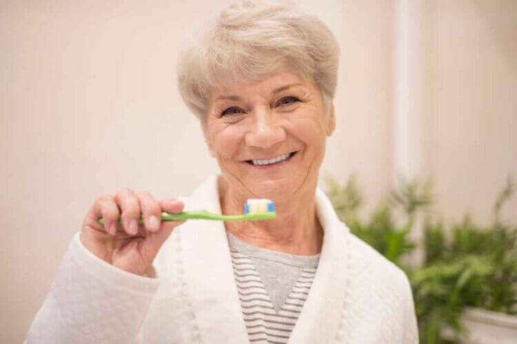 How To Care For A Dental Implant Vs. A Natural Tooth